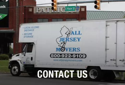 Contact us, phone number written on the All Jersey Movers van