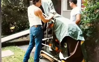 Two men covering the piano safely to moving